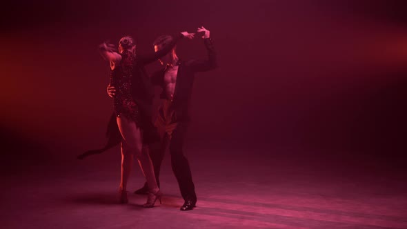 Full Length Professional Couple Dancing Indoors