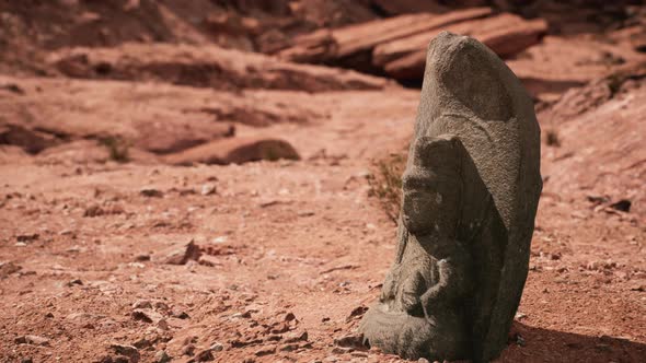 Ancient Statue on the Rocks Desert