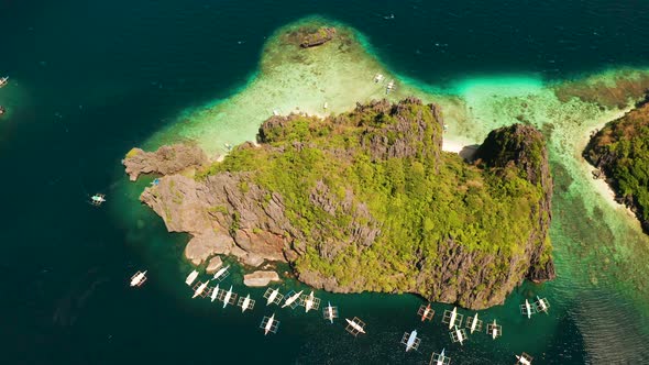 Aerial View of Boats and Limestone Cliffs