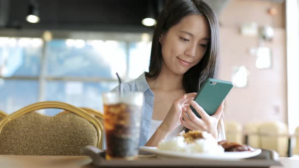 Woman Sending SMS on Cellphone