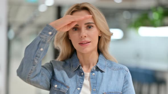 Curious Young Casual Woman Looking Around, Searching 