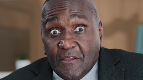 Extreme Closeup Old Wrinkled Emotional Businessman African American Scared Shocked Amazed Biracial