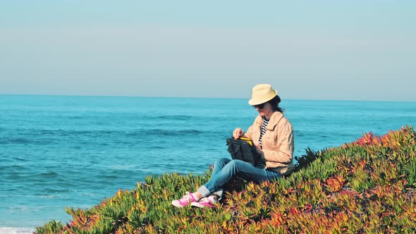 Woman Going To Work on Her Notebook Outdoors