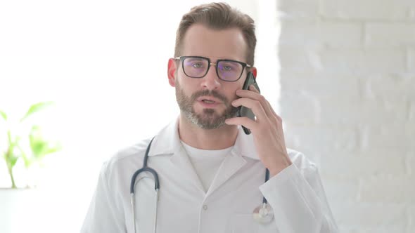 Portrait of Doctor Talking on Phone