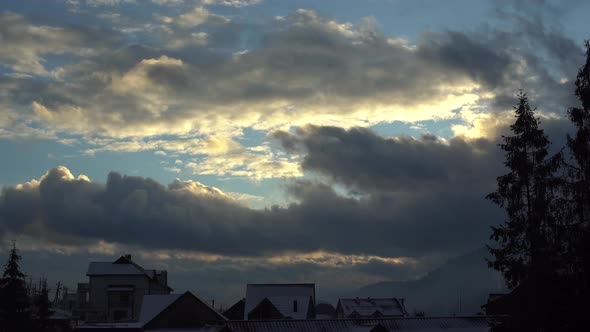 Winter Sky Over Rooftops and Treetops