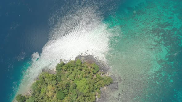 Aerial: flying over Banda Islands active volcano Gunung Api lava flows Indonesia