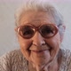 Slow Motion Portrait of a Happy Senior Woman with Gray Hair and Glasses. - VideoHive Item for Sale