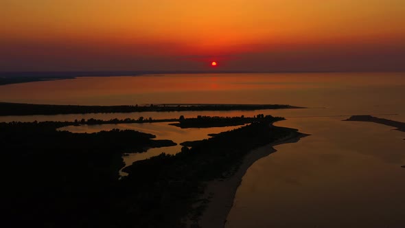 Drone aerial view Sunset Sun Over Sea.Orange Color Sunrise On Beach.Sunset On Sea Dramatic sea