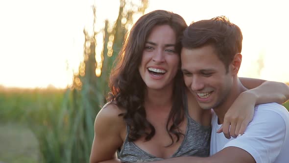 Young couple laughing together outdoors