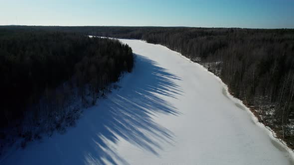 Nature of Russia  Flyover of River and Pine Trees Covered with Snow