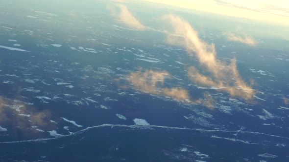 Plane soaring through cloud, aerial view of city and ocean nature landscape winter slow motion video