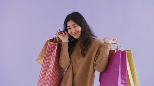 Asian Female in Brown Sweater