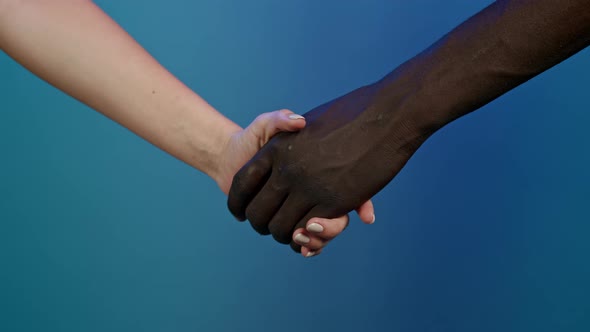 Hands of Black Man and White Woman. Handshake Close-up. Interracial Friendship, Anti-racism