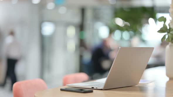 Open Laptop on Desk in Office Timelapse