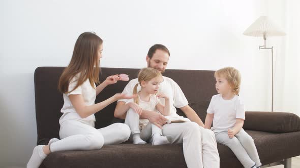 Happy Friendly Caucasian Family at Home