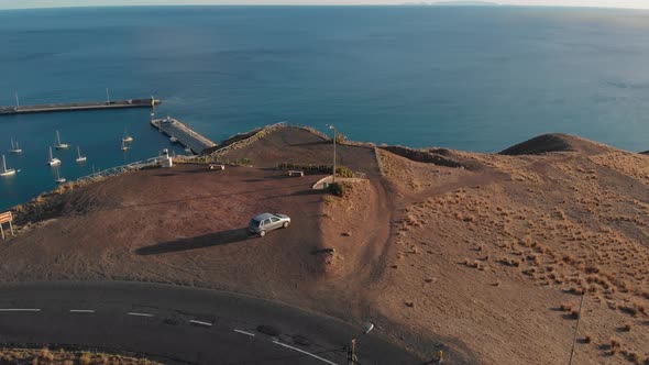 Flying over Portela viewpoint in Porto Santo island at sunset. Portugal