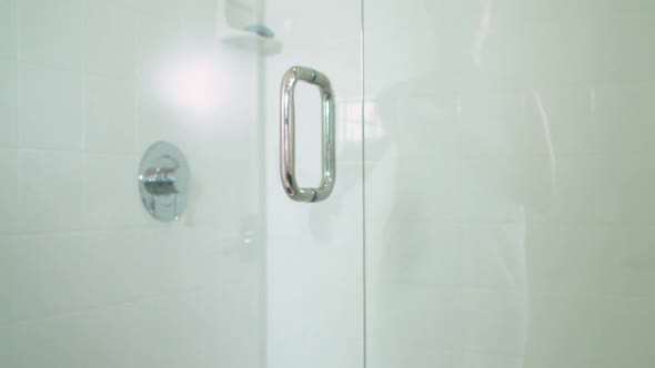 Woman Opening Shower Door