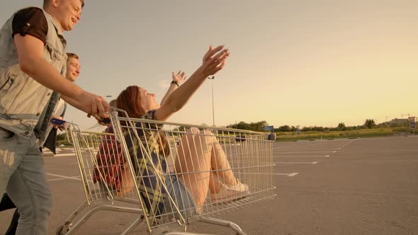 Young Friends Having Fun on a Shopping Carts