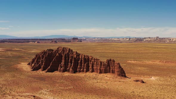 Red rock formation in wild desert of Utah national park, USA - Orbiting aerial shot