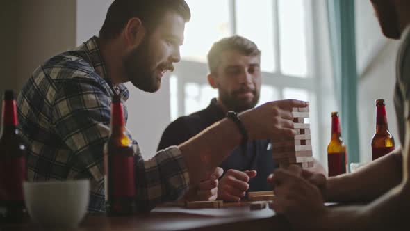 Guys Playing Block Tower Game