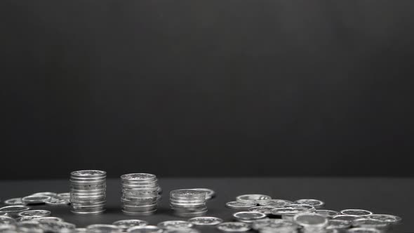 Stop Motion of Coins Piling Up 4K