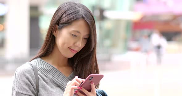 Woman use of mobile phone at outdoor