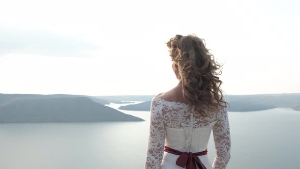 Magical and Mystic Girl Looking To the Coast From a Cliff