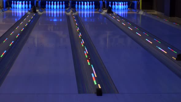 Colorful bowling alley. Bowling lane waiting for gamers.