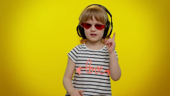 Cheerful Cute Blonde Child Kid Listening Music Via Headphones Dancing Disco Fooling Having Fun Party