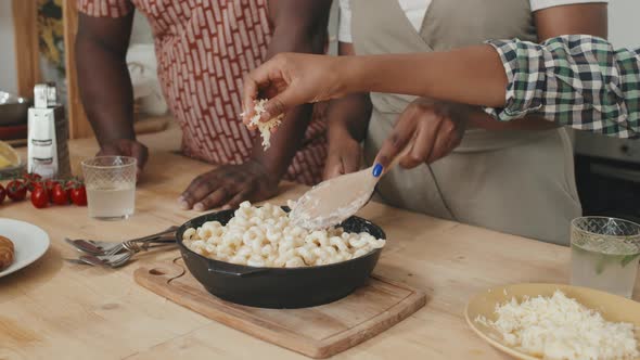 African American Family Making Mac and Cheese