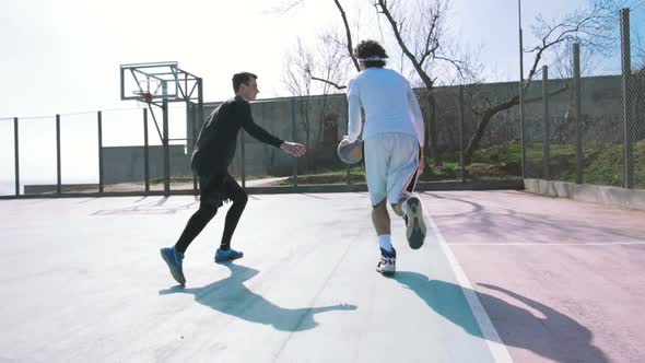 Two Basketball Player Playing Basketball Outdoors Slow Motion