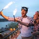 Happy Couple Having Fun and Partying on Balcony - VideoHive Item for Sale