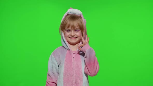 Little Child Girl Smiling Showing Ok Gesture Agree Sign in Unicorn Pajama on Chroma Key Background