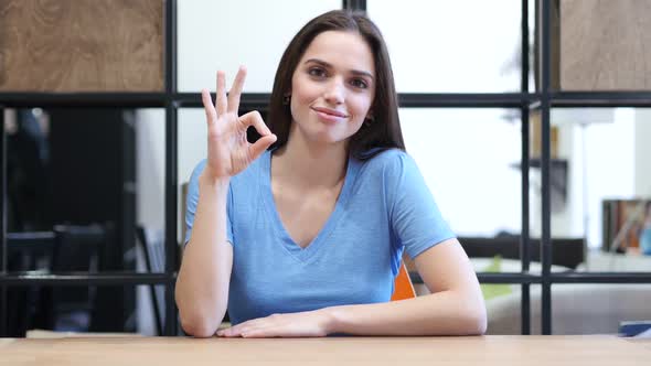 Beautiful Brunette Woman Showing Ok Sign, Indoor