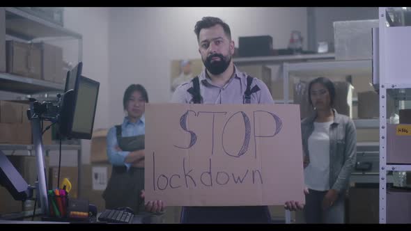 Man Holding Anti-lockdown Message