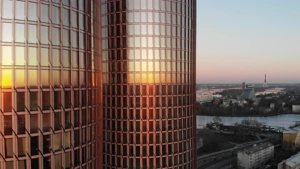 Scenic aerial drone view of Zunda Towers skyscrapers with Riga, Latvia cityscape on right side on a