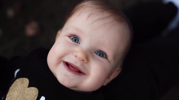 Newborn Baby Smiling at Camera