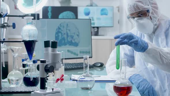 Slowly Zooming in Shot of Researcher in Modern Laboratory Taking Samples From Tubes