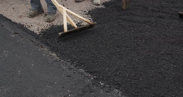 Laying Asphalt In A Pothole. Road Repairs