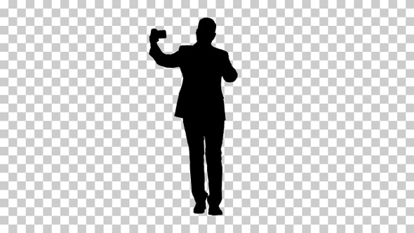 Silhouette Man taking a selfie while walking, Alpha Channel