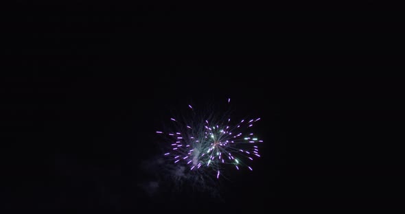 blue green and purple rings of fireworks