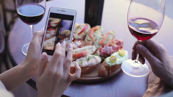 Food And Drink Photo. Woman Looking At Pictures On Phone Screen