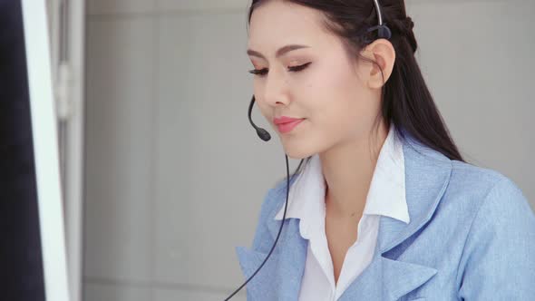 Customer Support Agent or Call Center with Headset Talking to Customer on Phone