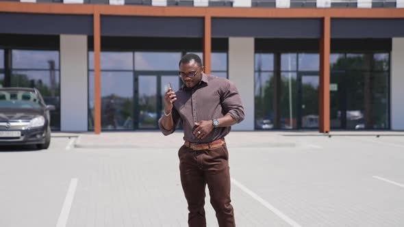 Handsome african american young man using phone outdoor