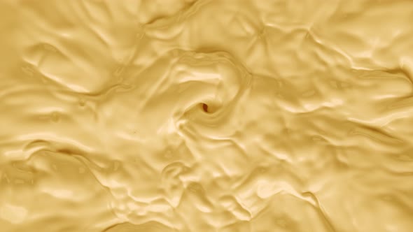 Super Slow Motion Shot of Swirling Yellow Milky Wortex at 1000Fps