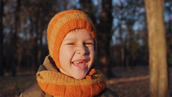 Cute Funny Boy Smiling with His Mouth Without Front Teeth