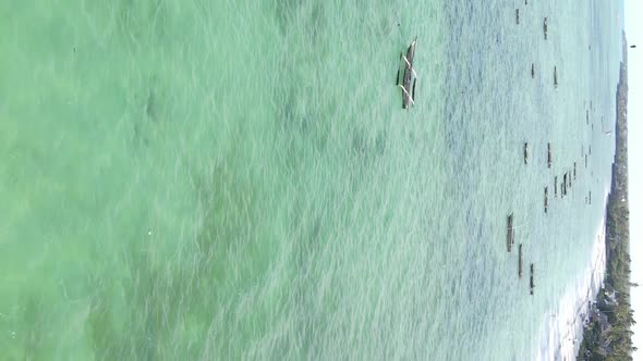 Tanzania Vertical Video  Boat Boats in the Ocean Near the Coast of Zanzibar Aerial View