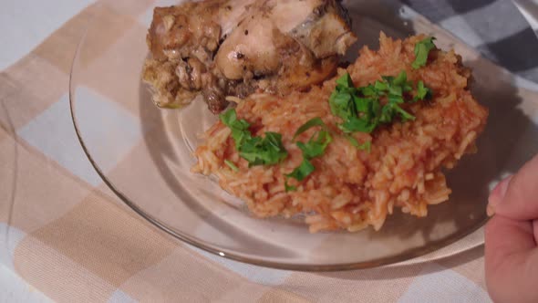 Nigerian Food Jollof Rice with Fried Chicken Closeup on a Plate