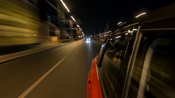 Drivelapse From Side of Car Moving on a Night Avenue in City Timelapse Hyperlapse