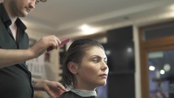 Young Woman Getting Her Hair Dressed in Hair Salon